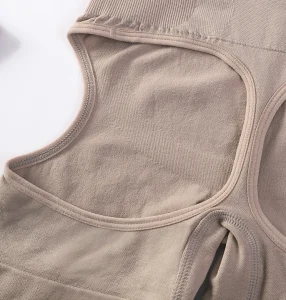Seamless beige tank top with cutout design, perfect for comfortable lingerie and layering.